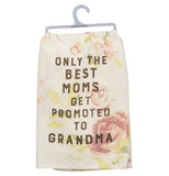 The front of the pink floral towel displays the words, "Only the Best Moms Get Promoted to Grandma" in brown lettering.