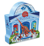 "Dinosaur Day at the Museum" Puzzle kit packaged in a light blue museum box with Dinosaur displays and children looking at them. 
