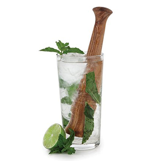The wood muddler is shown in a drink with ice, leaves, and a lime wedge.