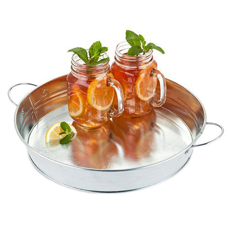 The galvanized metal serving tray is shown with two jars full of lemons and ice tea. Two leaves stick out of both drinks.