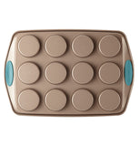 The "Blue" 12 Cup Muffin Pan is shown from the bottom that showed the deepness of the cup holes with the blue handles.