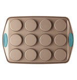 The "Blue" 12 Cup Muffin Pan is shown from the bottom that showed the deepness of the cup holes with the blue handles.