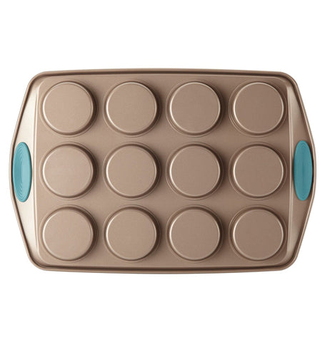 The "Blue" 12 Cup Muffin Pan is shown from the bottom that showed the deepness of the cup holes with the blue handles.