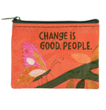 An orange coin purse has a pink and yellow butterfly resting on a dark green branch with leaves of varying shades of yellow. In black text, it reads "Change is good, people."