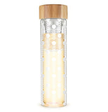 Glass travel mug with floral design with a tan bamboo lid on top with a silver colored stainless steel infuser on a white background.