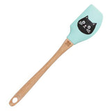 The blue spatula with the wooden handle and the black cat