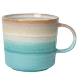 A Ceramic Glaze Color Coated Mug that in tan and blue layers.