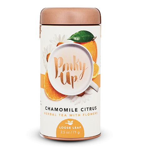 Off white cylinder shape container that has an image of oranges with the words Pinky Up covering up part of the image. The words Chamomile Citrus Herbal Tea with Flowers is underneath. Container has a copper colored lid.