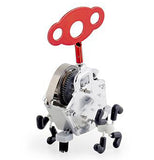 The "Pink Ling" is a silver wind-up toy with a red key on top for winding it up. 