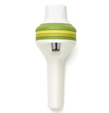 This vegetable slicer with green and yellow cylinders has a narrow silver slot to make cut vegetables into pasta.
