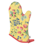 This yellow oven mitt with a red edge has strawberries and blueberries in the background.