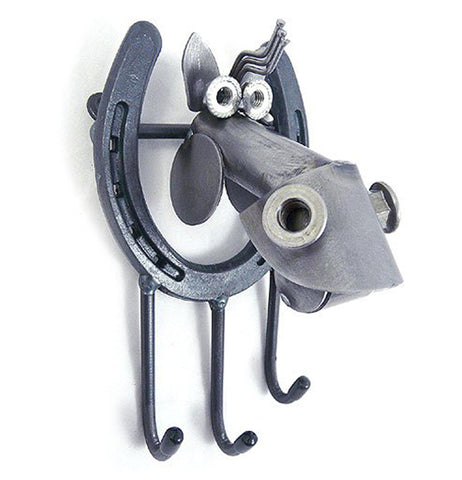 This metal horseshoe shaped sculpture features another metal sculpture shaped like a horse's head. Below the horseshoe is a set of three hooks for hanging keys.