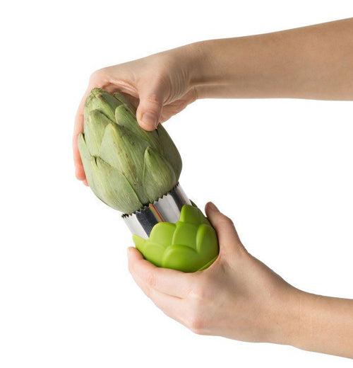Person using artichoke blade to cut into artichoke. 