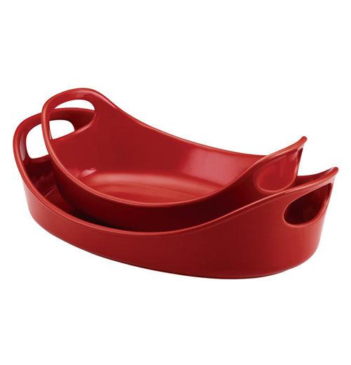 The "Red" 2 Piece Bubble &amp; Brown Ceramic Baker Set has a small dish and a medium dish, with the smaller one inside the bigger one, that are bright red with wide handles on each side.