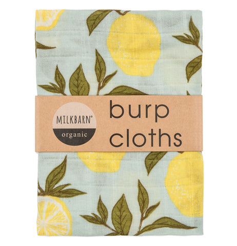 This turquoise baby burp blanket features yellow lemons hanging from green leaves with a brown wrapper that says "MilkBarn burp cloths"
