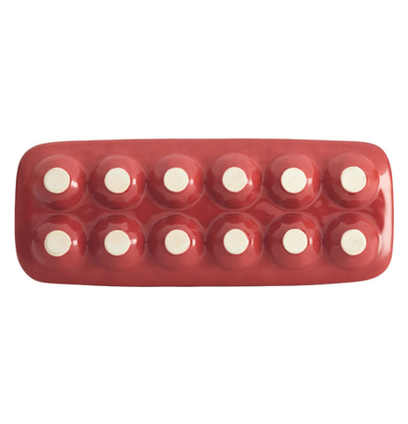 The bottom of the red egg tray is shown.