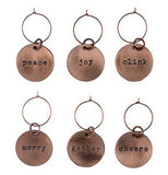 These six copper wine charms each have different words on them. The first says "Peace", the second says "Joy", the third says "Clink", the fourth says "Merry", the fifth says "Gather", and the sixth says "Cheers".