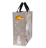 The side of the bag is shown with a orange tabby cat, a gray and white cat, and a white cat with black and orange stripes.