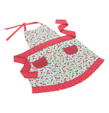 White ladies apron with a red cherry pattern all over, shown laid flat. Apron has 2 red pockets at the hip, a red waist band, red neck band, and red ruffle on the bottom edge.