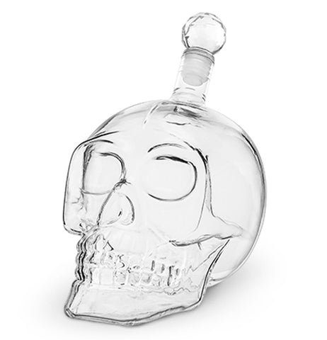 This glass drink container is shaped like a human skull.