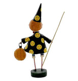 The sorcerer figurine is shown from the rear with the yellow smiling faces on his hat and coat showing clearly.