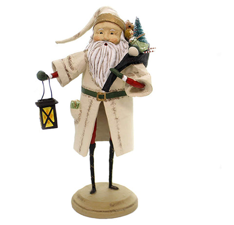 This old time Santa Claus figurine is wearing a white coat with a toy and a tree on his back and is carrying a lantern.