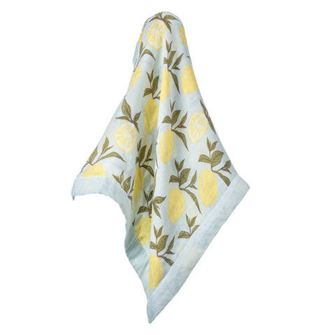 This light blue blanket features a design yellow lemons with forrest green leaves.