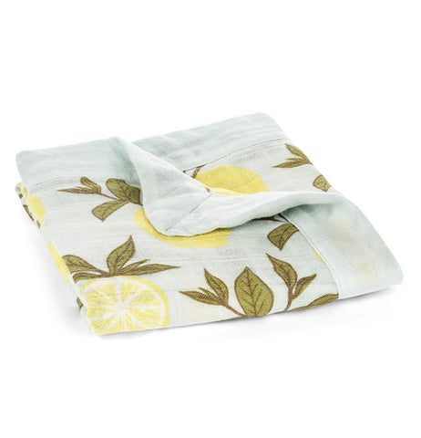 Shown here the light blue blanket with yellow lemons and forrest green leaves folded.