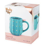 The green cactus-shaped mug is inside its box with its picture on the front. In the upper left hand corner are the words, "Pinky Up" in gold lettering.