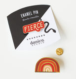 This red and silver colored pin that says Fierce on the black and white package.