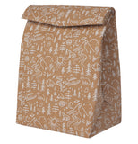 Sealed brown lunch bag with white outdoor themed design over a white background.