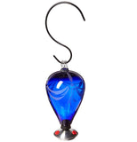 A dark blue spherical glass hummingbird feeder has three red feeders for hummingbirds to feed through. The feeder is hanging by a S-style hook, which is fully visible.