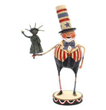This figure is dressed in an outfit and top hat designed after the American Flag, and holding a miniature statue of liberty.
