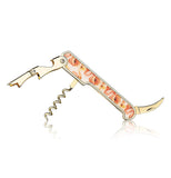 The corkscrew with the orange and pink poppy design is shown with all its metal handles out and unfolded.