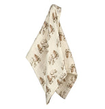 This white baby blanket features a design of gray elephants wearing brown tutus.