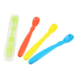 The set of four "Primary" Infant Spoons features the colors of blue, yellow, red and a green spoon in a clear plastic case.. 