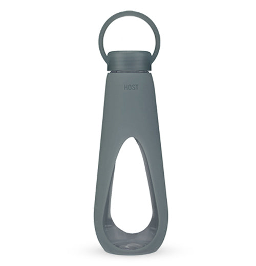 This glass water bottle has a dark gray plastic sleeve covering most of it. Its gray lid is also made of plastic with a handle.