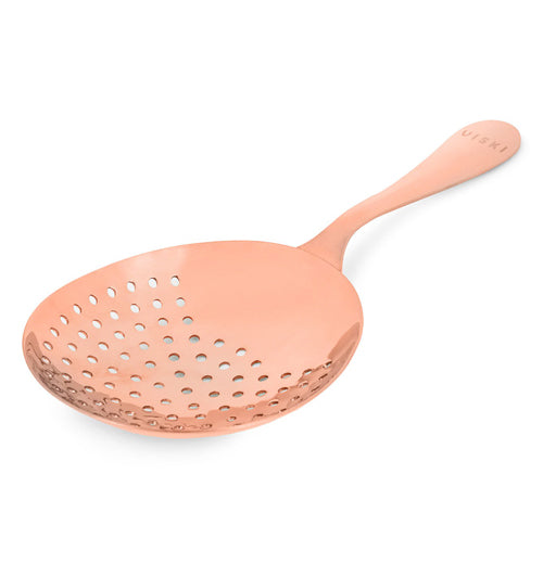 The copper drink strainer is shown from a curved frontal view-point.