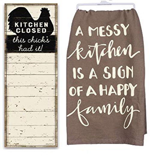 The brown towel is shown next to a black and white chicken sign saying, "Kitchen Closed: This Chick&