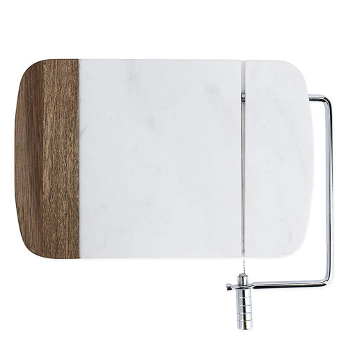 The white and brown cutting board with the wire cutter is shown from a downward looking angle.