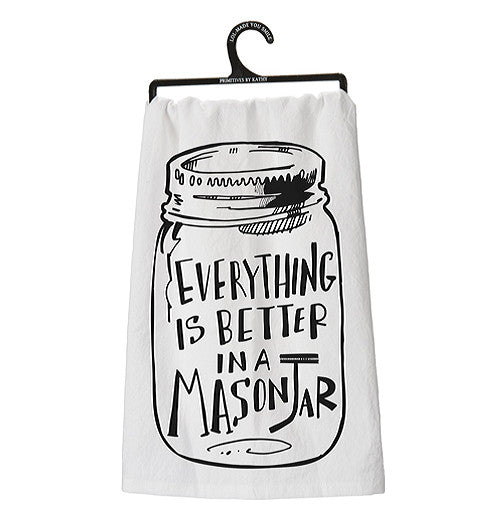 Dish Towel that says "Everything is better in a mason jar" in black with a white background  hanging on a hanger.