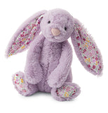 A purple bunny with flowers inside ears and bottom of feet.