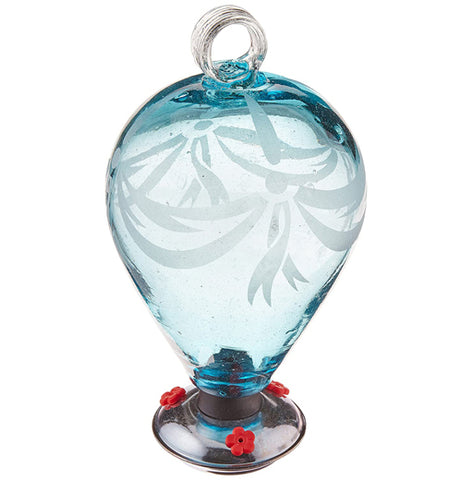 A light blue spherical glass hummingbird feeder has three red feeders for hummingbirds to feed through.