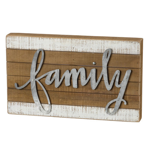 This wooden block features the word "Family" stenciled in steel and attached to the wood.