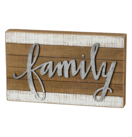 This wooden block features the word "Family" stenciled in steel and attached to the wood.