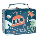 Metal lunch box with ocean theme.