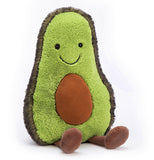 Front view a green stuffed medium "Amuseable Avocado" with a happy face and brown feet and a brown pit inside its tummy.
