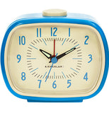 Blue and off-white vintage styled alarm clock with black hands and red numbers.