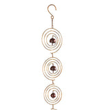 Bells in the middle of spirals on a chain with a hook on a white background.