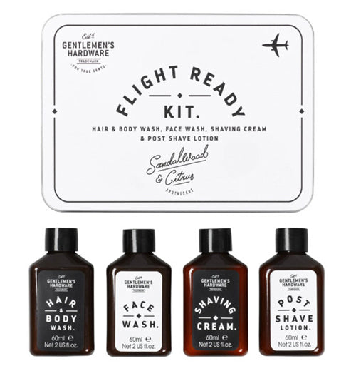 The white box with the words, "Flight Ready Kit" in black lettering is shown with its contents below it. The contents are small bottles of hair and body wash, face wash, shaving cream, and aftershave.